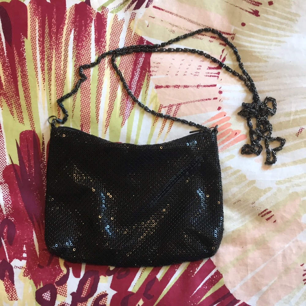 Small, black, "chain mail" metal purse